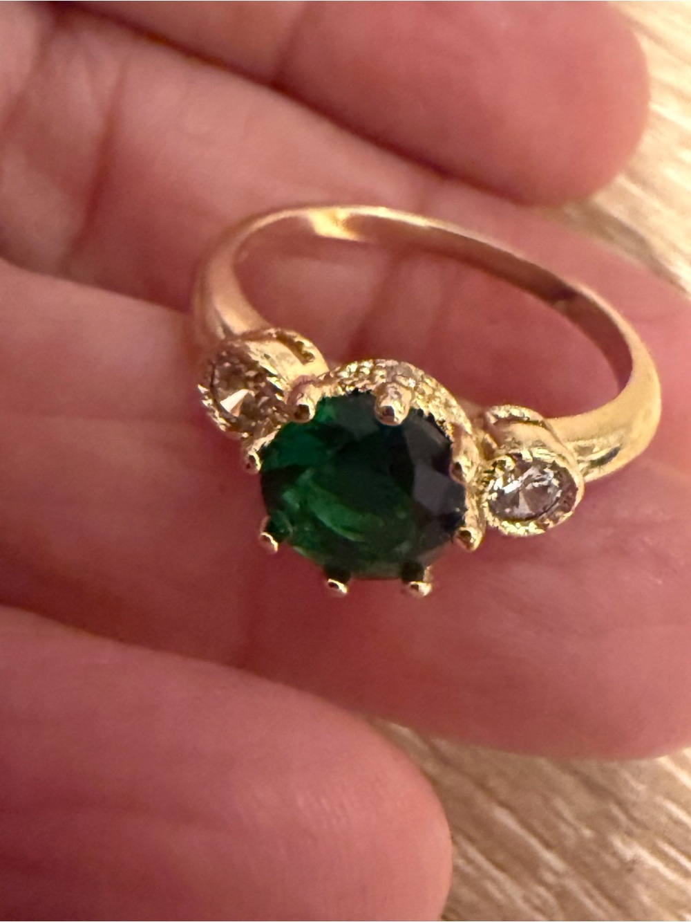 Gold Ring with Emerald Green Center Stone and Accent Diamonds